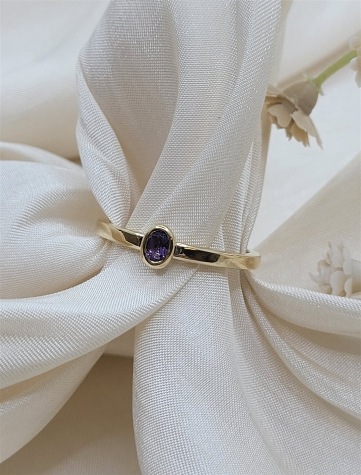 14K Yellow 4X3mm Oval Solitaire Bezel Set Amethyst Ring