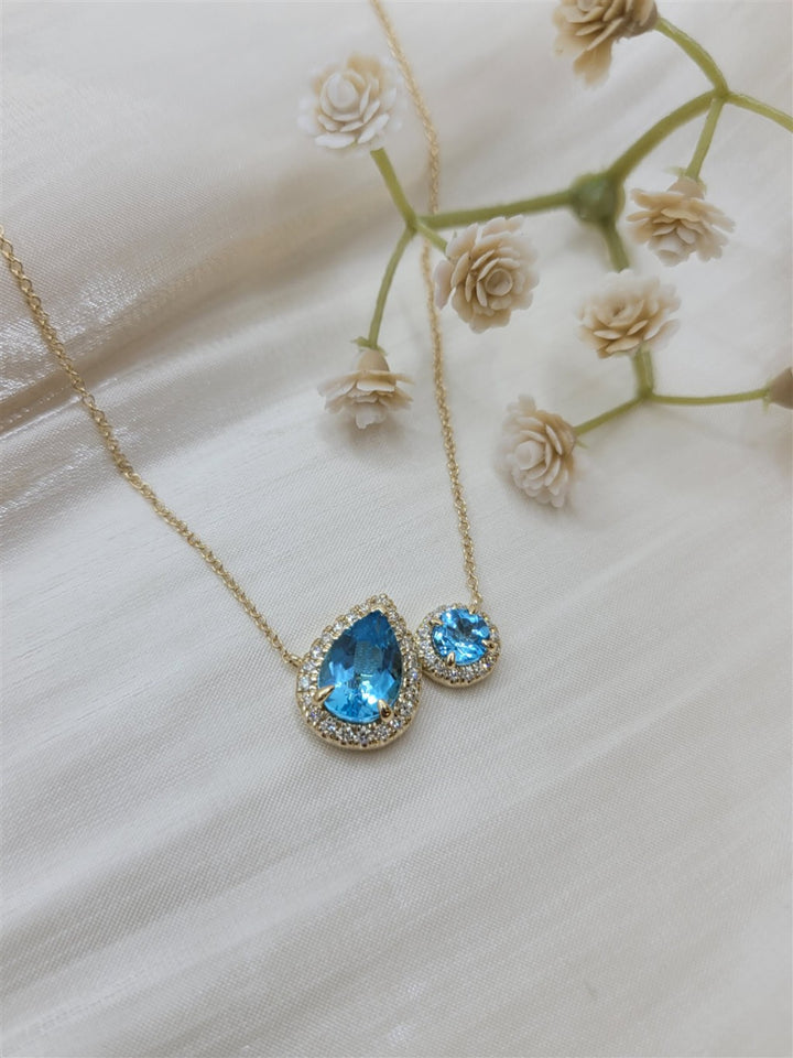 17.5" 14K Yellow Gold Toi Et Moi Blue Topaz And Diamond Halo Necklace